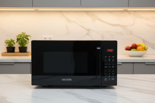 Black countertop microwave oven with digital control panel and keypad