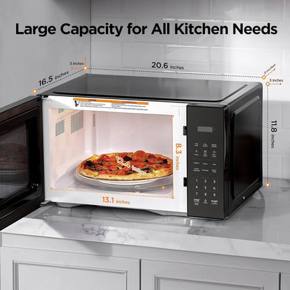 Black countertop microwave oven with digital controls, open door, and large pizza inside, showing interior and exterior dimensions.