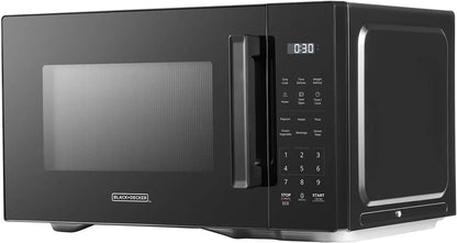 Black countertop microwave oven with digital display and touch control panel