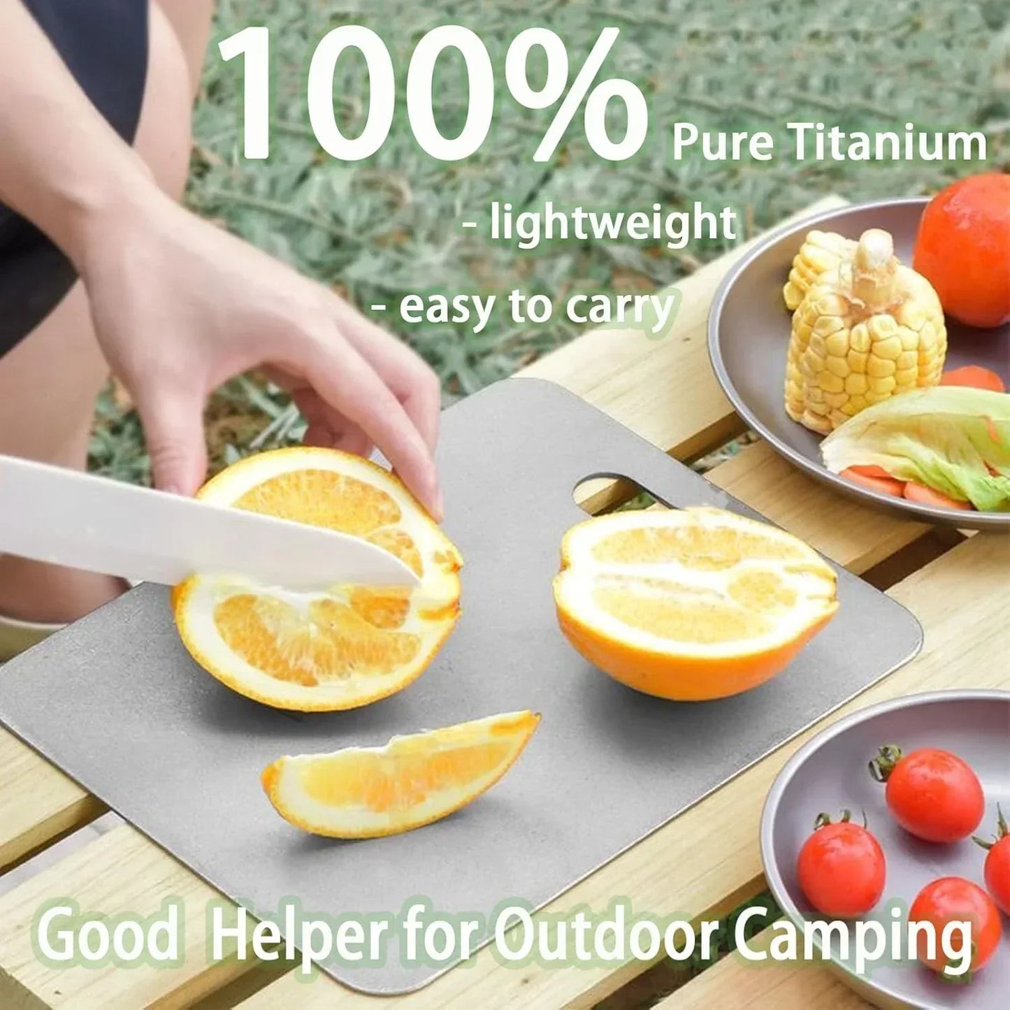 Lightweight pure titanium cutting board slicing oranges for outdoor camping