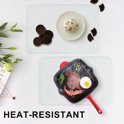 Heat-resistant glass trivets protecting countertops from hot skillet and ice cream bowl, ideal kitchen accessories