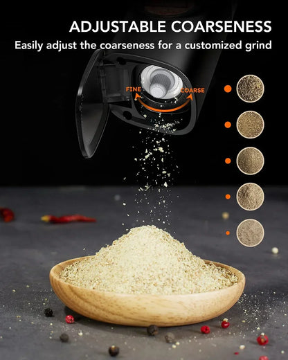 Adjustable electric spice grinder with fine to coarse settings, grinding fresh pepper into wooden bowl