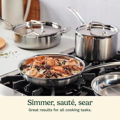 Stainless steel cookware set on stove with seared scallops, perfect for sautéing, simmering, and searing meals.