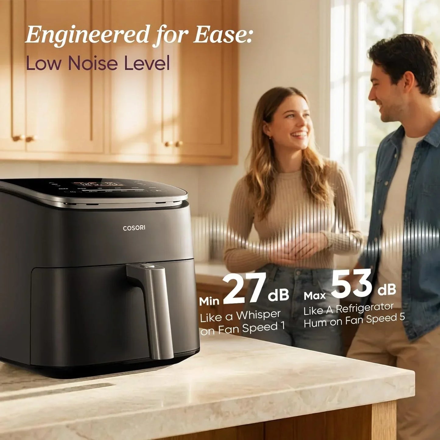 Quiet COSORI air fryer on kitchen counter with couple, low noise 27-53 dB, engineered for ease