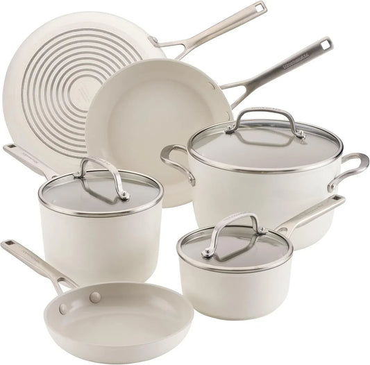 Cream ceramic cookware set with glass lids and stainless steel handles for modern kitchen cooking