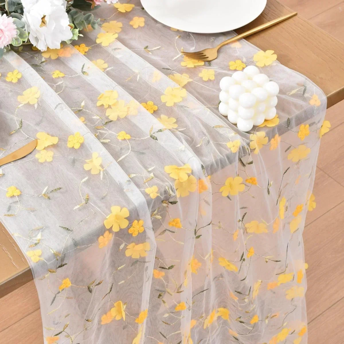 Sheer table runner with yellow floral embroidery, perfect for elegant dining table decor and kitchen styling.