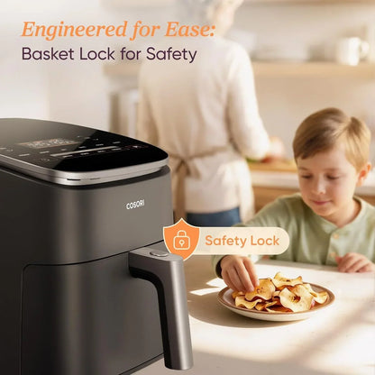 COSORI air fryer with safety lock, child eating apple chips in kitchen