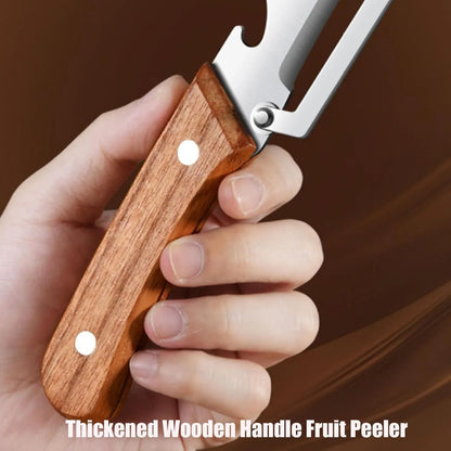 Hand holding a stainless steel fruit peeler with a thick wooden handle against a brown background.