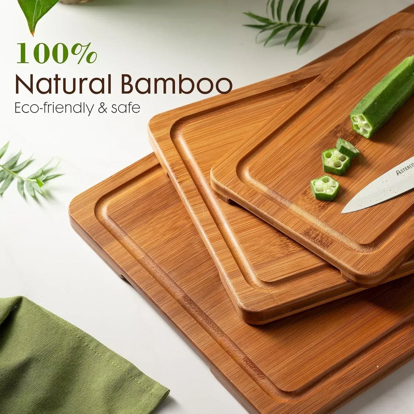 Natural bamboo cutting boards with sliced okra and knife, eco-friendly kitchen essentials